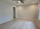 Bright bedroom featuring wood-look floors, a ceiling fan, neutral paint, and a closet at 5185 Sw 158Th Pl, Ocala, FL 34473