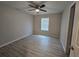 Inviting bedroom with modern ceiling fan and window that fills the room with natural light at 5185 Sw 158Th Pl, Ocala, FL 34473