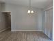 Bright dining room with modern chandelier and sliding glass doors for lots of natural light and easy access to outside at 5185 Sw 158Th Pl, Ocala, FL 34473