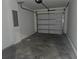 Garage interior showing garage door, walls, and ceiling at 5185 Sw 158Th Pl, Ocala, FL 34473