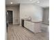 Stylish kitchen island with granite countertops and stainless steel appliances with lots of natural light at 5185 Sw 158Th Pl, Ocala, FL 34473
