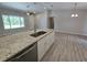 Gourmet kitchen island with granite countertops, stainless steel appliances, and plenty of cabinet storage space at 5185 Sw 158Th Pl, Ocala, FL 34473
