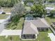 A view of the home featuring a screened-in pool, spacious yard, and neighborhood at 5347 Pecan Rd, Ocala, FL 34472