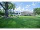 This property boasts a large manicured lawn, screened lanai and a beautiful home with plenty of natural light at 5347 Pecan Rd, Ocala, FL 34472