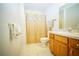 Standard bathroom featuring tile floors and a shower-tub combination with cream-colored tile surround at 5347 Pecan Rd, Ocala, FL 34472