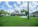 A home with a green lawn and landscaping at 5347 Pecan Rd, Ocala, FL 34472