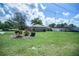 A home with a green lawn and landscaping at 5347 Pecan Rd, Ocala, FL 34472