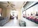 Hallway featuring tile flooring, patterned curtains, and access to adjacent living areas at 5347 Pecan Rd, Ocala, FL 34472