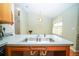 Spacious kitchen area featuring a double stainless sink and ample countertop space at 5347 Pecan Rd, Ocala, FL 34472
