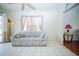 Cozy living room features tiled floors, a ceiling fan, neutral colors and large windows providing natural light at 5347 Pecan Rd, Ocala, FL 34472