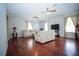 Spacious living room with hardwood floors, neutral walls, and comfortable seating arrangement at 5347 Pecan Rd, Ocala, FL 34472