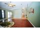 Bright living room featuring wood flooring, neutral walls, and ample natural light at 5347 Pecan Rd, Ocala, FL 34472