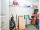 Storage closet featuring shelving, storage containers, a wheelchair, and folding chairs at 5347 Pecan Rd, Ocala, FL 34472