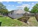 View of the backyard showcasing a screened in porch, large yard, and white tent structure at 5500 Se 2Nd Pl, Ocala, FL 34480