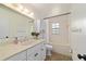 Bathroom featuring a tub with shower, marble countertop, and white cabinets at 5500 Se 2Nd Pl, Ocala, FL 34480