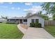 Charming single-story home featuring a walkway leading to the front door and well-maintained landscaping at 5500 Se 2Nd Pl, Ocala, FL 34480