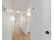 Bright hallway showcasing a view of the bathroom with tile flooring at 5500 Se 2Nd Pl, Ocala, FL 34480