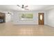 Bright and inviting living room with tile flooring, a cozy fireplace, and an abundance of natural light at 5500 Se 2Nd Pl, Ocala, FL 34480