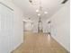 Open floor plan with tile flooring and elegant lighting fixtures at 5500 Se 2Nd Pl, Ocala, FL 34480