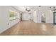 Spacious living room with neutral tile flooring and abundant natural light, creating an inviting atmosphere at 5500 Se 2Nd Pl, Ocala, FL 34480
