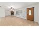 Open living space featuring tile floors, a charming stone fireplace, and ample natural light from large windows at 5500 Se 2Nd Pl, Ocala, FL 34480