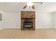 Cozy living room with a stone fireplace, tile flooring, and modern ceiling fan at 5500 Se 2Nd Pl, Ocala, FL 34480