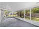 Large screened porch, offering backyard views with shed at 5500 Se 2Nd Pl, Ocala, FL 34480