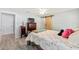 Bedroom featuring wood-look floors, large dresser and decor, and natural light at 6 Sequoia Loop, Ocklawaha, FL 32179