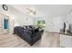 Comfortable living room features a large sectional sofa and light, airy decor at 6 Sequoia Loop, Ocklawaha, FL 32179