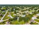 A lovely neighborhood showcases beautiful homes with mature trees, vibrant green lawns and well-maintained streets at 6113 Sw 101St Pl, Ocala, FL 34476