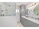 Updated bathroom with dual sinks, modern vanity, and luxurious walk-in shower at 6113 Sw 101St Pl, Ocala, FL 34476