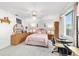 Bedroom features classic-style furnishings with a desk by the window and a circular mirror above a dresser at 6113 Sw 101St Pl, Ocala, FL 34476