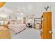 Bright bedroom features a ceiling fan, large window, and furnishings with a classic style and a calming color scheme at 6113 Sw 101St Pl, Ocala, FL 34476