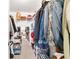 Walk-in closet provides ample storage with shelves and hanging rods for organized clothing and accessories at 6113 Sw 101St Pl, Ocala, FL 34476
