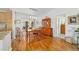 Well-lit dining area with wooden furniture, hardwood floors, and sliding glass doors at 6113 Sw 101St Pl, Ocala, FL 34476