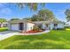 Beautiful one-story home featuring a well-manicured lawn and charming curb appeal at 6113 Sw 101St Pl, Ocala, FL 34476