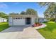 One-story home featuring a well-manicured lawn and charming curb appeal at 6113 Sw 101St Pl, Ocala, FL 34476