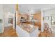 Eat-in kitchen featuring granite countertops, light wood cabinets, and stainless steel appliances at 6113 Sw 101St Pl, Ocala, FL 34476