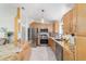 Kitchen showcases stainless steel appliances, granite countertops, and ample cabinet space at 6113 Sw 101St Pl, Ocala, FL 34476