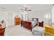 Bright main bedroom featuring carpet, windows, closet and ensuite bathroom at 6113 Sw 101St Pl, Ocala, FL 34476