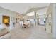 Inviting dining room with tile floors, decorative chandelier, and access to the kitchen and entryway at 6330 Sw 117Th Loop, Ocala, FL 34476