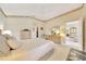 Comfortable main bedroom with a walk-in closet, ensuite bath, and neutral decor for relaxation at 6330 Sw 117Th Loop, Ocala, FL 34476
