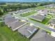 Aerial view of single Gathering homes within a community; red car visible at 7067 Sw 60Th Ln, Ocala, FL 34474