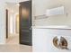 Bathroom with a walk-in shower and view to the water closet with modern black door at 7067 Sw 60Th Ln, Ocala, FL 34474