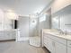 Bright bathroom with a large glass walk-in shower and double sink vanities at 7067 Sw 60Th Ln, Ocala, FL 34474