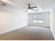 Bright bedroom features plush carpet, ceiling fan, and recessed lighting at 7067 Sw 60Th Ln, Ocala, FL 34474