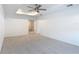 Spacious bedroom with tray ceiling, recessed lighting, and neutral carpet at 7067 Sw 60Th Ln, Ocala, FL 34474