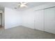Bedroom with ceiling fan, carpet, closet with sliding doors, and white walls at 7067 Sw 60Th Ln, Ocala, FL 34474