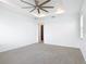 Bright bedroom featuring neutral carpet, a ceiling fan, recessed lighting, and an open doorway at 7067 Sw 60Th Ln, Ocala, FL 34474
