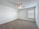 Bedroom with plush carpet, closet with double doors, and bright window at 7067 Sw 60Th Ln, Ocala, FL 34474